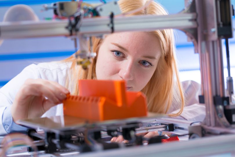 Woman using a 3D printer - Fast Radius