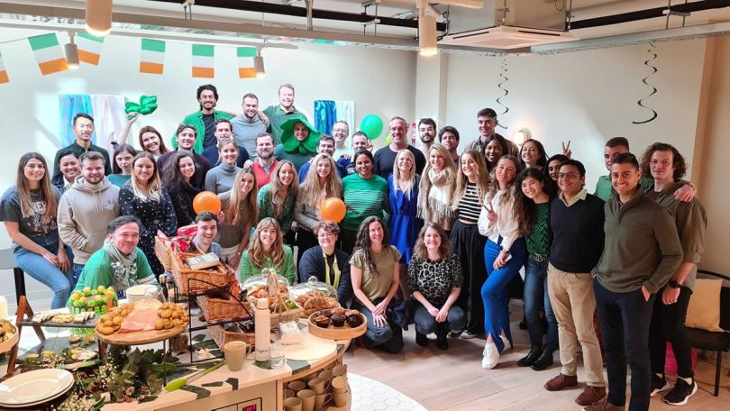 Figma team members posing for a group photo in the office
