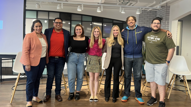 LogicMonitor team members pose for a photo after a fireside chat. 