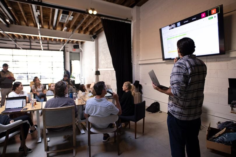 Flowcode team members having a meeting in the office