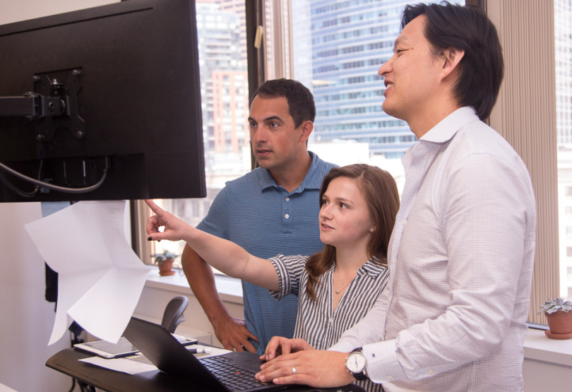Forward Financing team working on a computer