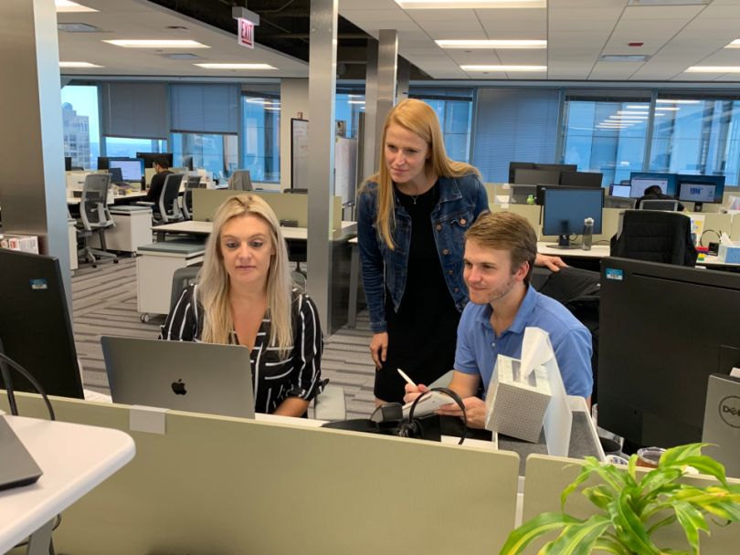 FourKites team working at a desk
