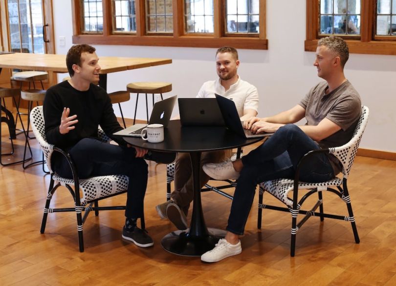 Foxtrot staff chatting in office