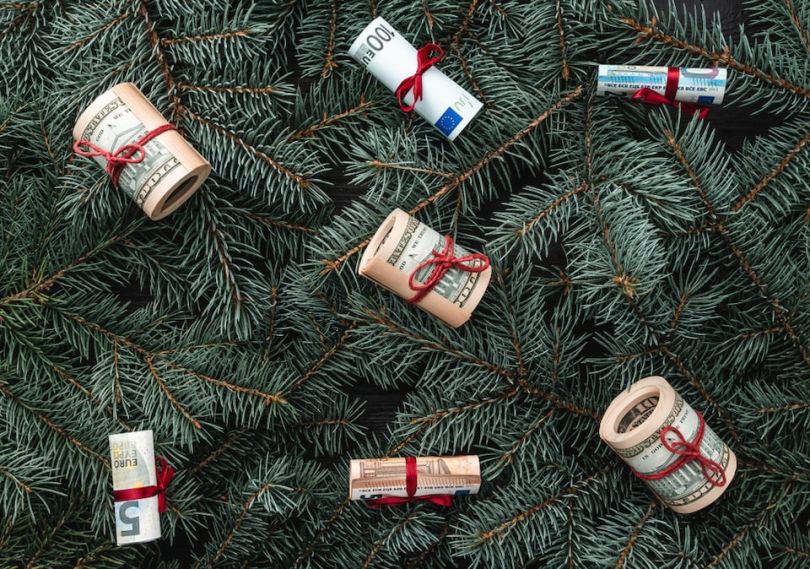 Money bundles hanging from Christmas tree