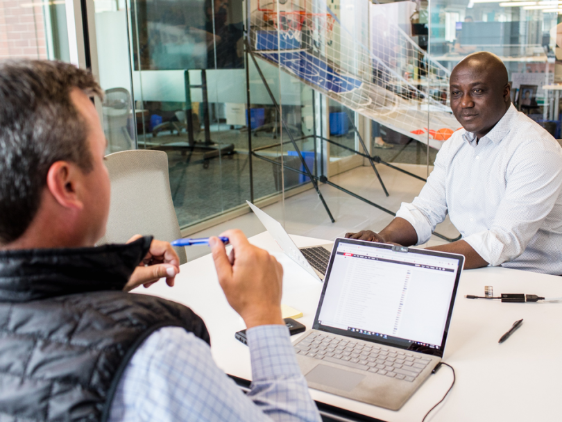 George Asante chatting with John Steele - Pareto Intelligence