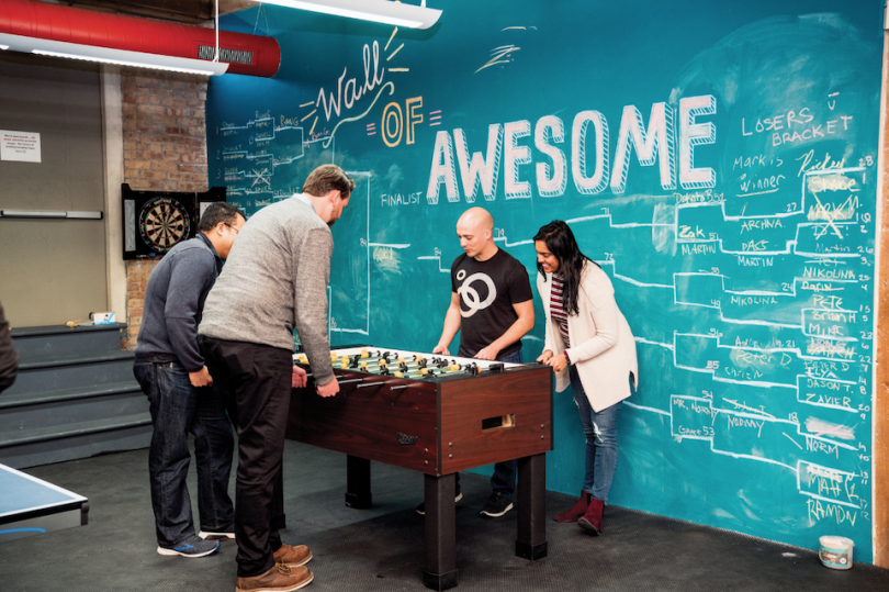 Guaranteed Rate team playing foosball