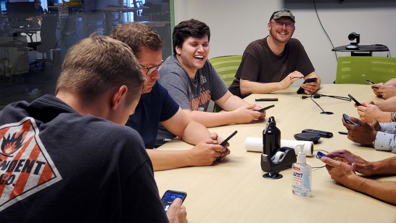 GutCheck team working at conference table