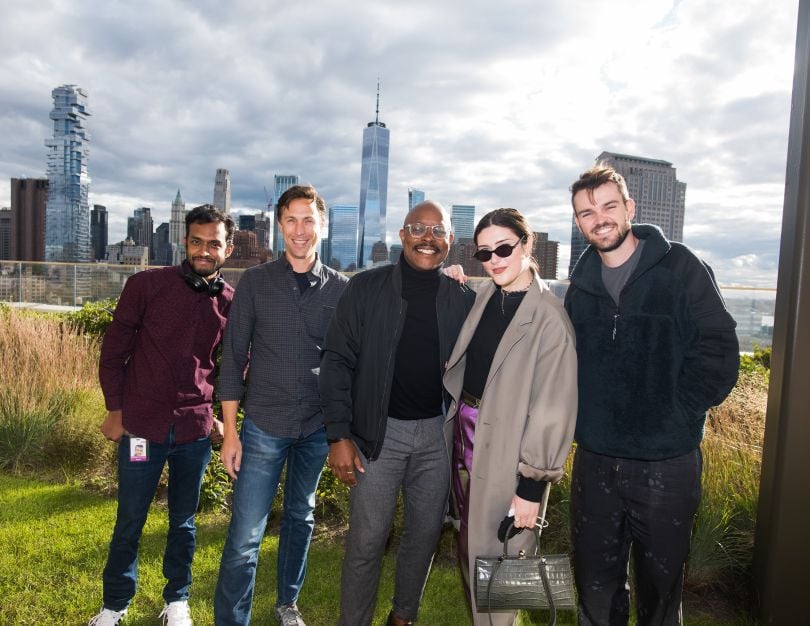 Harry's team =members with NYC skyline in background