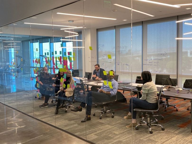Helium 10 office with team members having a meeting in a conference room