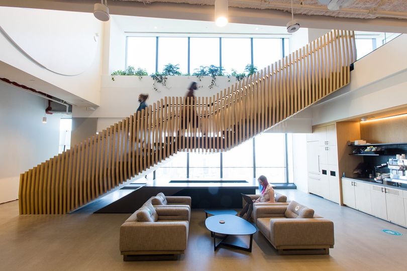 Hudson River Trading team members going up a staircase in the office