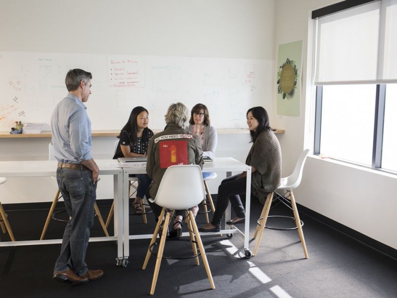 IHS Market's leadership team meets in the office