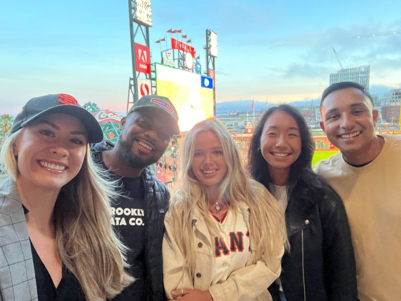 Fivetran team members at a baseball game