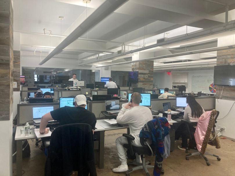 Photo of DearDoc open office space, with staff working at desks