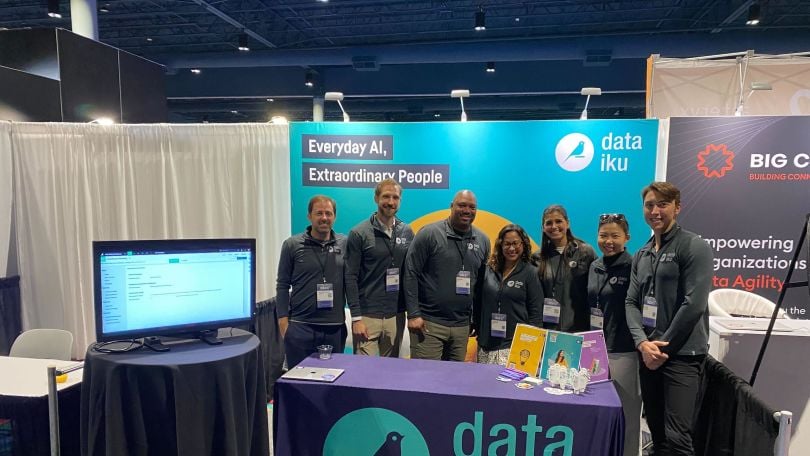Dataiku team members at a conference.