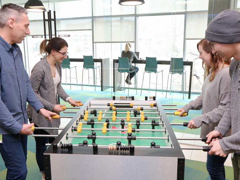 Lance playing foosball