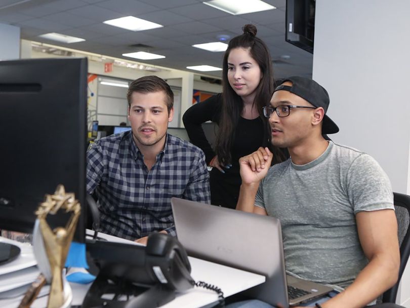 CB insights Team computer huddle