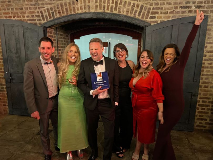 Immersive Labs team members celebrating an award