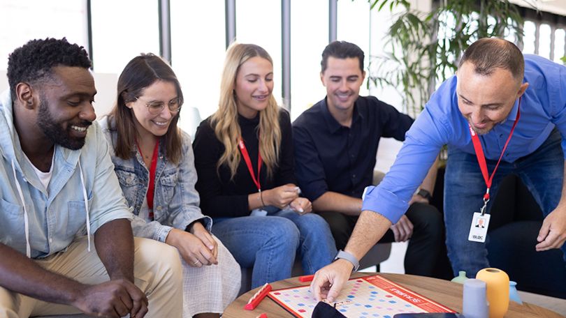 InStride team members play a rousing game of Scrabble together.
