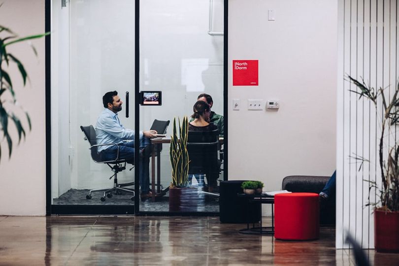 InStride team members having a meeting in a conference room at the office