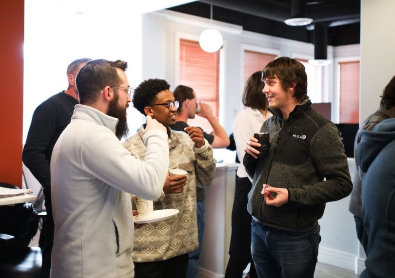 Jumpcloud's team chatting at social event