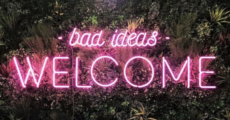 Jumpcut neon sign that says "bad ideas welcome"