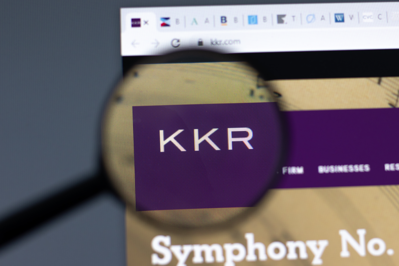 KKR Kohlberg Kravis Roberts website in browser with company logo under a microscope on a computer screen
