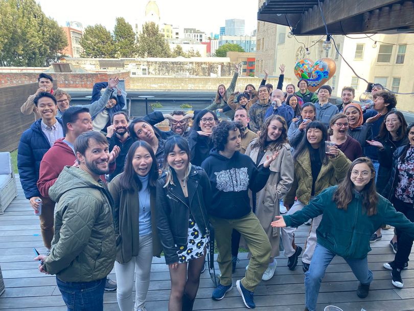 Kapwing group photo outside on a rooftop patio