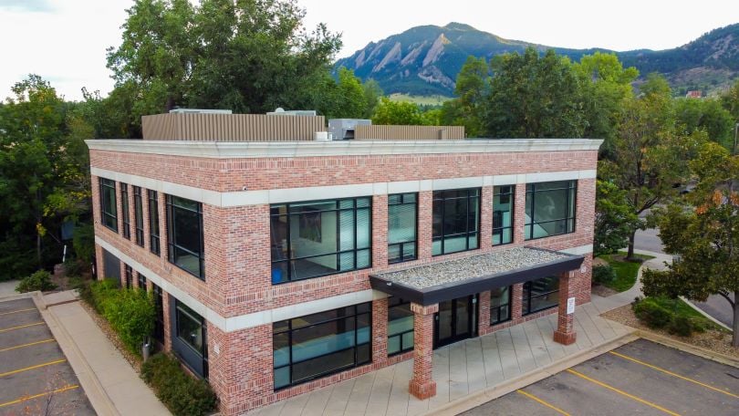 KeHE Distributors office building facade with mountains in the background.