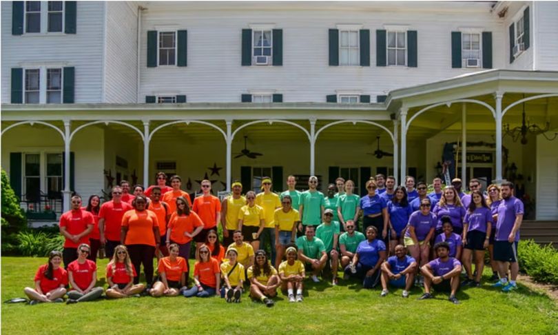 Landis' team gathers outside for a group photo