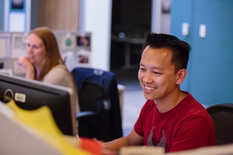 LegalZoom team members in the office working on computers