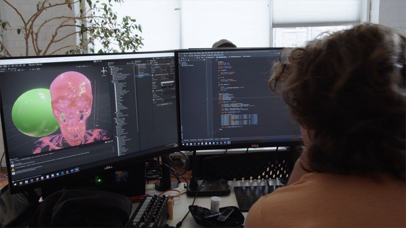 Level Ex team member working on a computer in the office