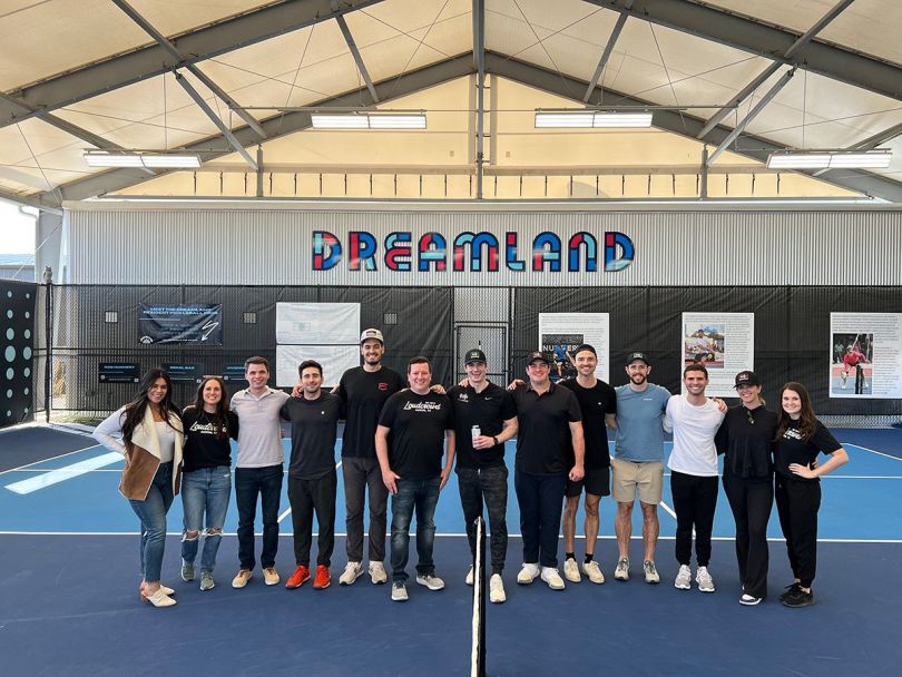 LoudCrowd team photo on a pickleball court
