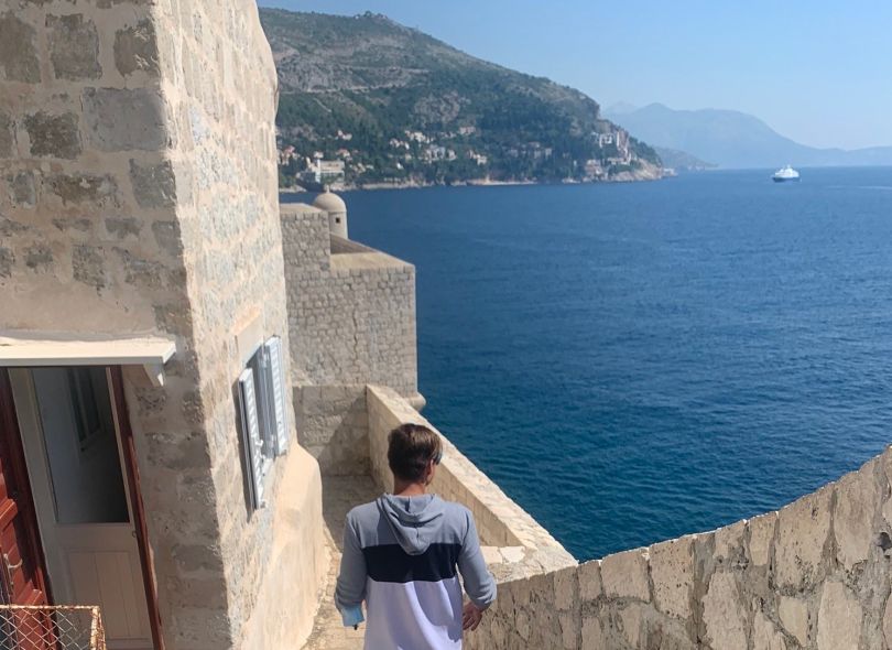 Marko Iwanik walking along the water in Croatia.