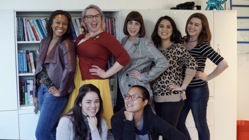 Women at Mastery Logistics Systems standing for a photo