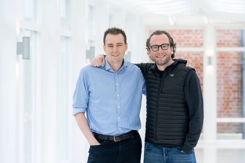 Two Matillion coworkers standing together