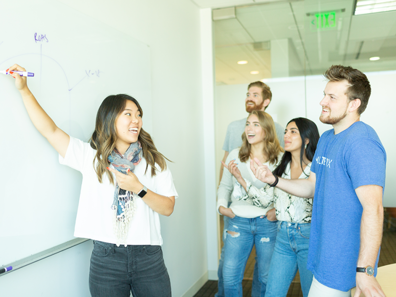 Lea Hong writes on a whiteboard