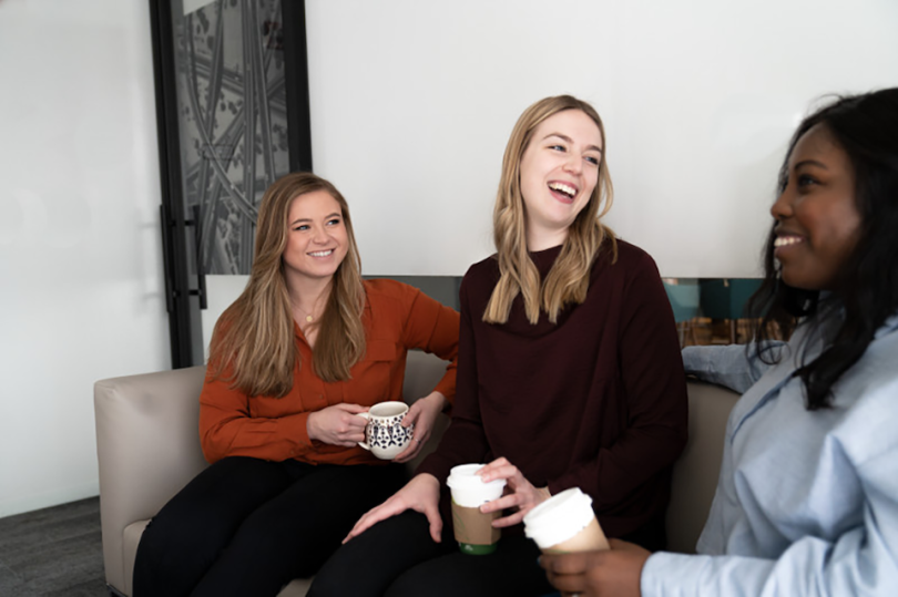 Motorola Solutions team members chatting on a couch