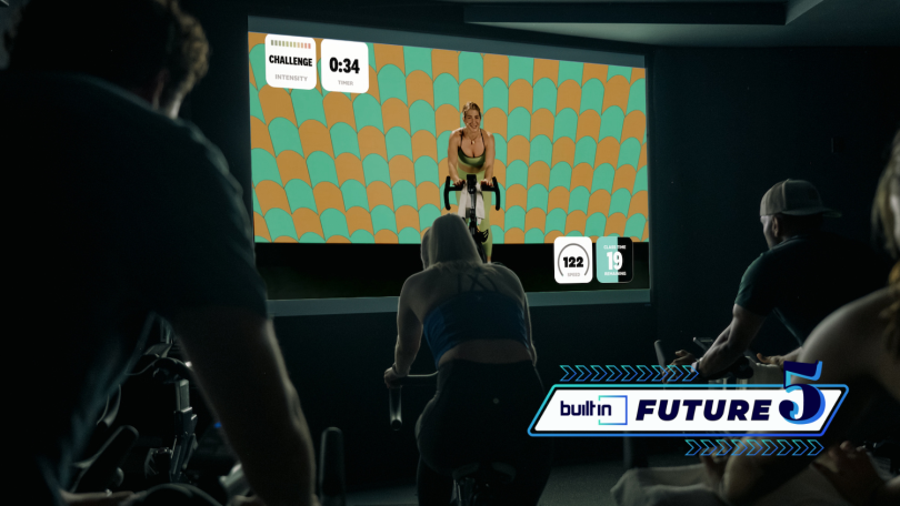 A Swerve Fitness instructor leading a group cycling class via livestream.