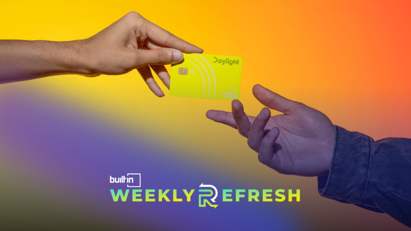A person handing a Daylight banking card to another person.