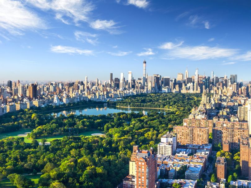 An overhead view of New York City, featuring the green expanse of Central Park