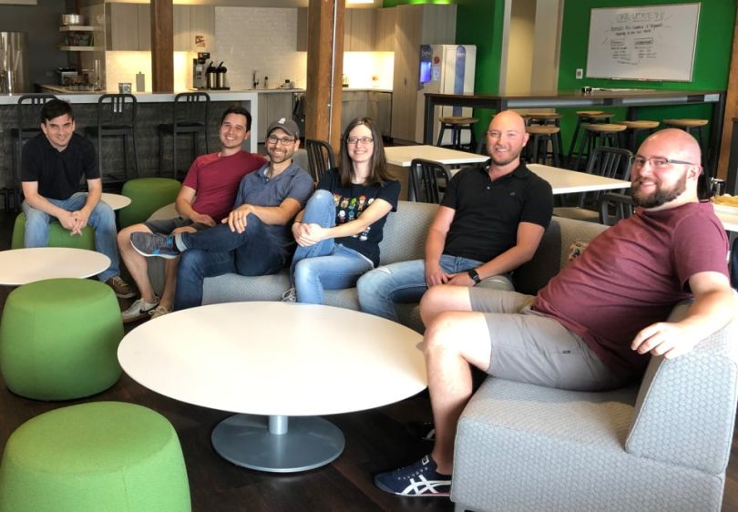 Neighborhoods.com team sitting in their office
