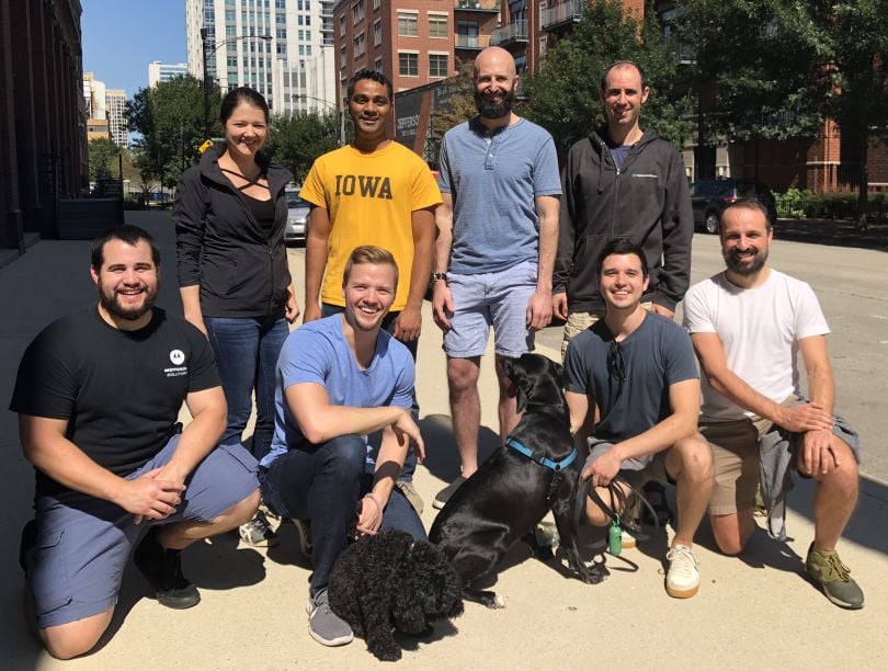 Neighborhoods.com team posing on the street