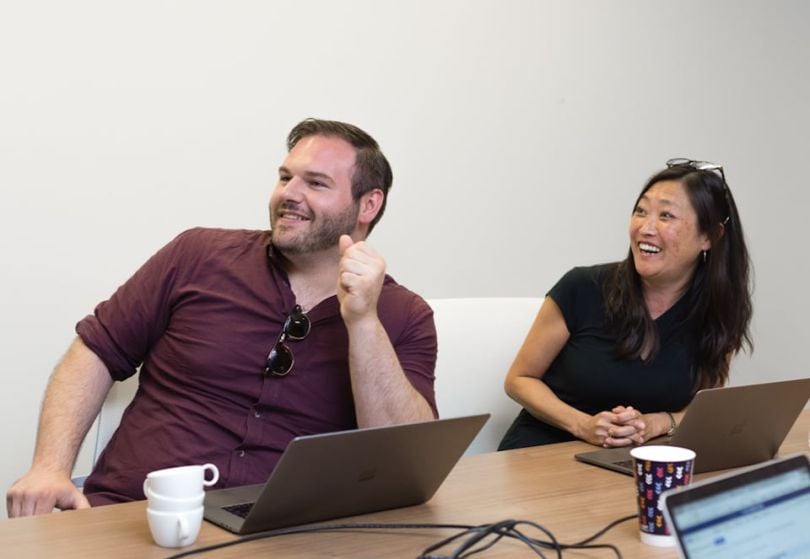 Networked Insights team members chatting and laughing