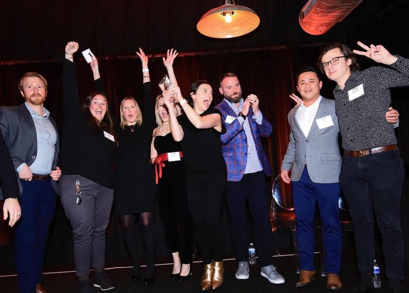 New Era ADR team members cheering and celebrating