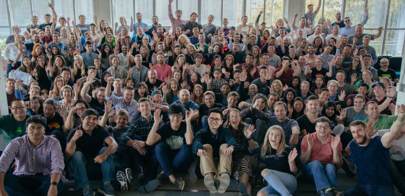 A group photo of NextRoll employees in their office.