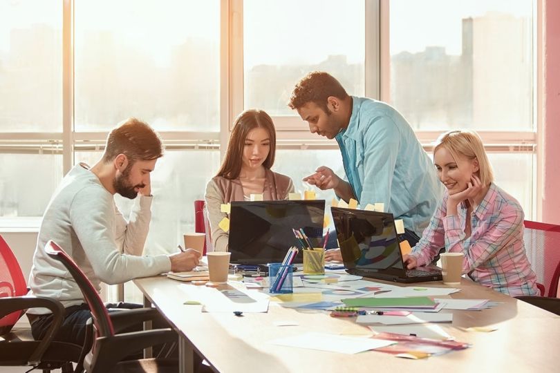 Group of designers working on a project as a team.