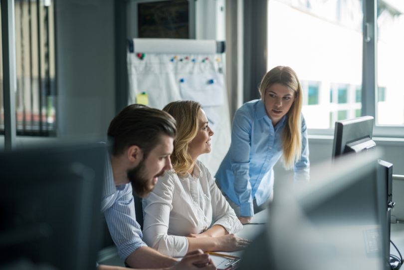 Young professionals working in an office - OneMain Financial