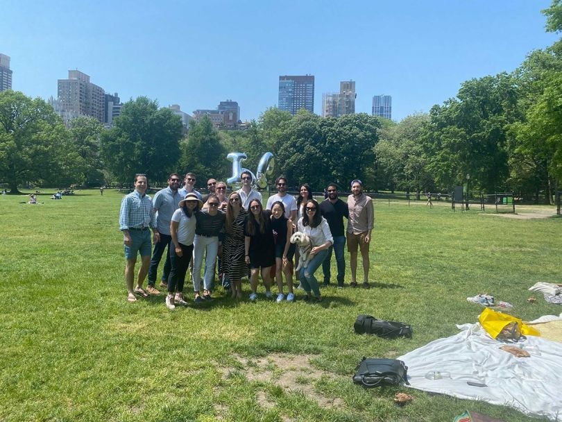 Ontra team members hanging out in a park together