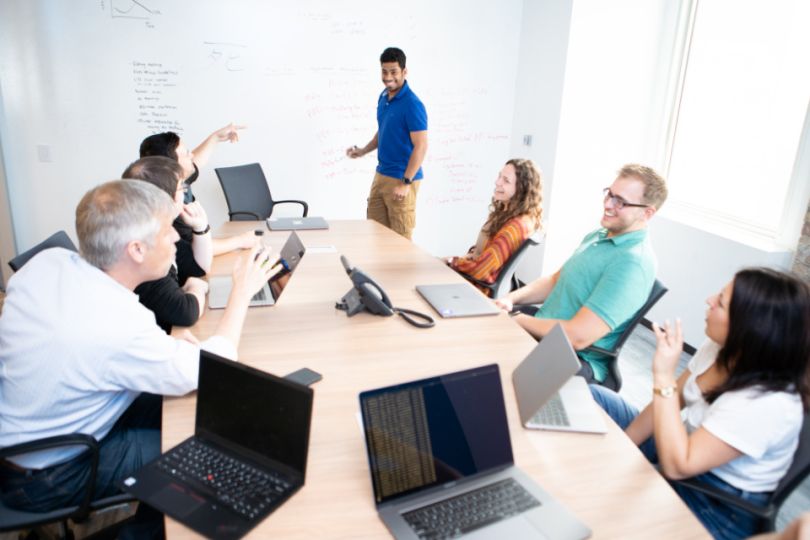 OppLoans team members in conference room working