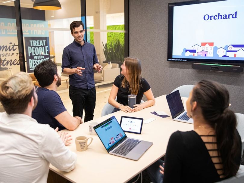 Orchard team members having a meeting.